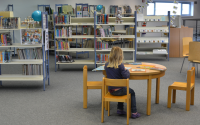 pupil sat in a primary school library