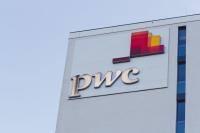 The PricewaterhouseCoopers logo on the side of a tall building