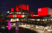 A photo of the National Theatre at night