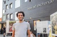 Saad Eddine Said, CEO and Artistic Director of New Art Exchange, standing outside the building