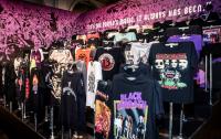 A photo of rows of T shirts with Heavy Metal logos