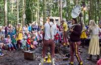 Photo of outdoor musical event in a wood