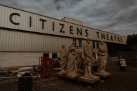 Statues ready to be lifted into place on the new Citizens Theatre façade in August 2023