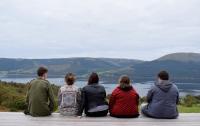 Photo of 5 young people with lake & hills