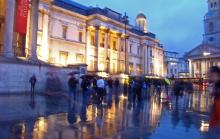 A photo of people in the rain outside London's National Gallery