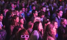 Photo of audience with 3D glasses on