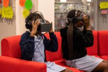 Two schoolchildren using VR