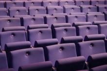 Photo of purple auditorium seats