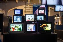 'Project What If' exhibition at We The Curious. Eight tv screens showing different visual imagery.