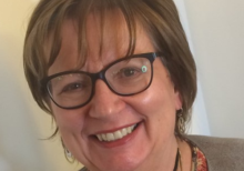 Sue Williamson, a woman with short brown hair wearing glasses