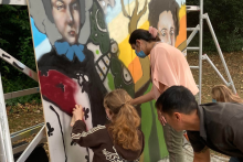 Young people working on graffitti