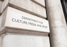 Entrance sign to the UK government building for the DCMS on London's Whitehall, England.