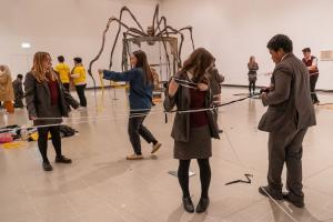 Images of school pupils with a lousie bourgeois sculpture