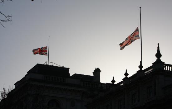 Union flags flying at half mast