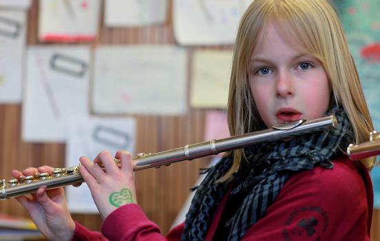 Photo of a girl playing the flute