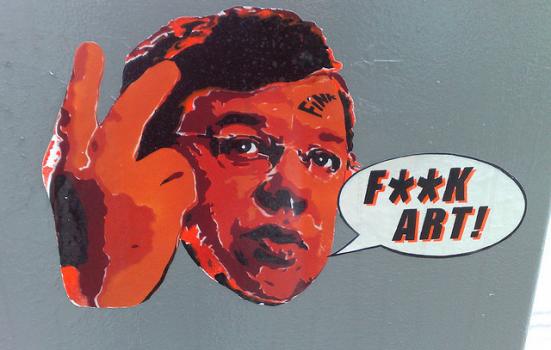 Photo of street art of Brian Cowen saying "F**K ART!"