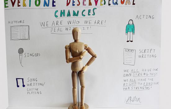 Image of wooden man and notes
