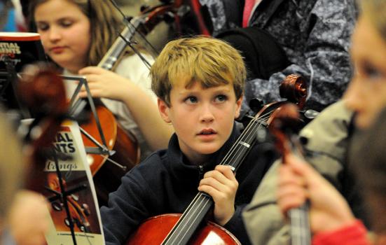 Photo of a boy in an orchestra