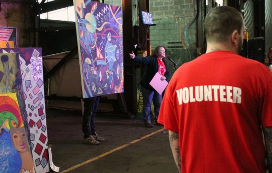 Photo of a man wearing a 'Volunteer' tshirt