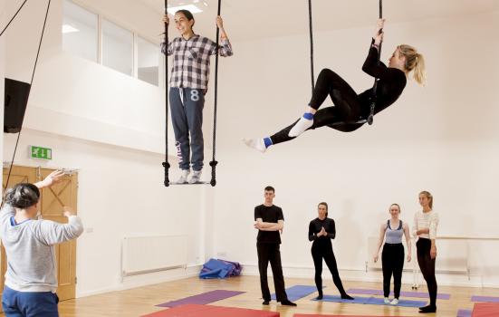 Photo of two aerial dancers, teacher and students