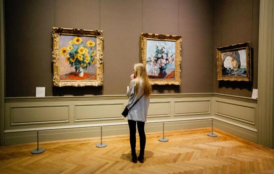 a woman visits an art gallery