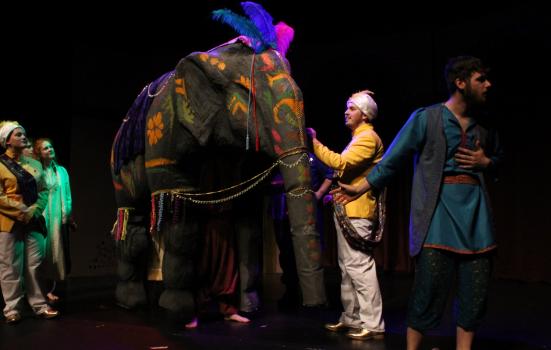 Actors and elephant puppet on stage