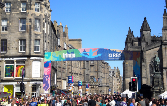 a crowd gathers at Edinburgh Fringe Festival