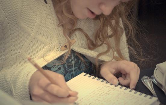 Photo of a girl writing