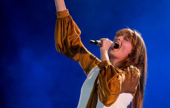 Florence + The Machine performing at a music concert