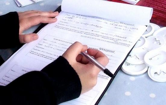 Photo of someone filling in a form