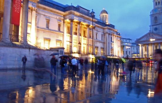 A photo of people in the rain outside London's National Gallery