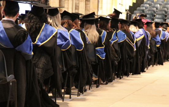 graduates in a line on graduation day