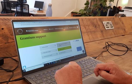 User accessing Grantium on laptop computer