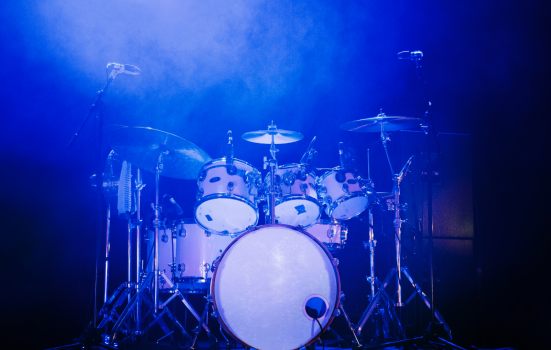 image of a drumkit on a music stage