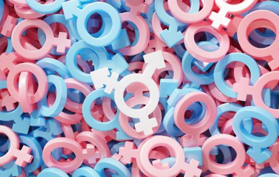 White transgender symbol on the background of many pink and blue gender symbols. The colours of the transgender flag. 3D illustration via iStock.