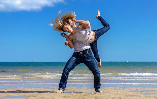 Man and woman dancing on the beach 