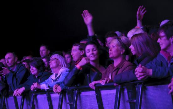 Photo of audience in purple light