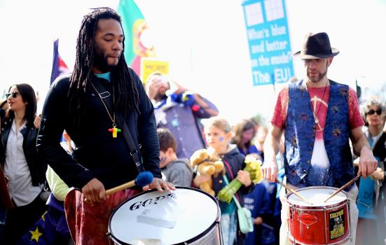 A photo of two men drumming at an anti-Brexit protest