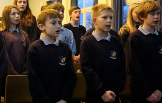 Photo of school children singing