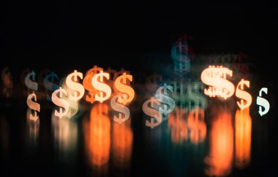 Image of multiple dollar signs in on a black background