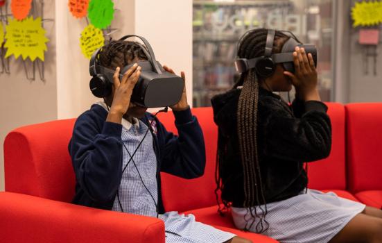 Two schoolchildren using VR