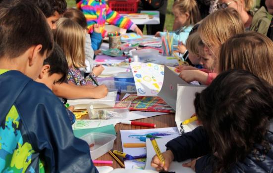 Photo of a group of children colouring