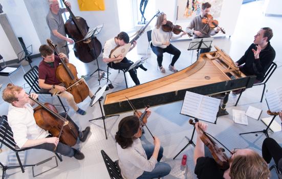 small chamber orchestra performing with period instruments
