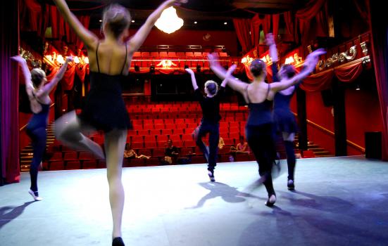 Photo of dancers rehearsing on stage