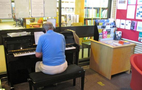 Image of pianist in library