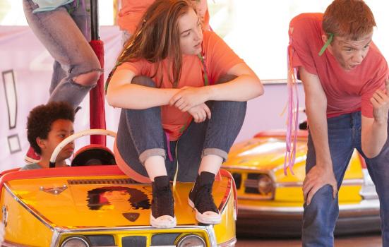 Young people performing on dodgems