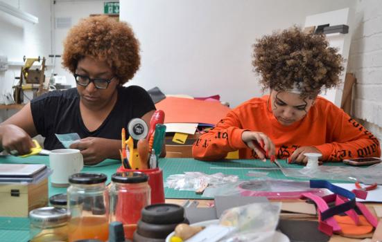 Photo of Craftspace. Two young people doing craftwork