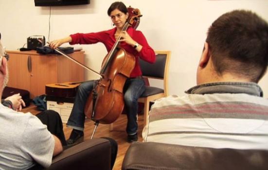 Photo of cellist performing for patients