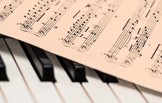 Image of piano keys and music