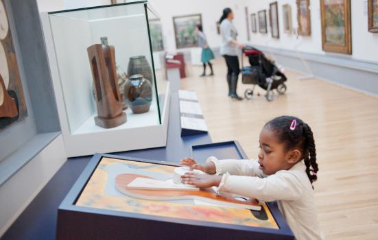 Young girl looking at a museum display